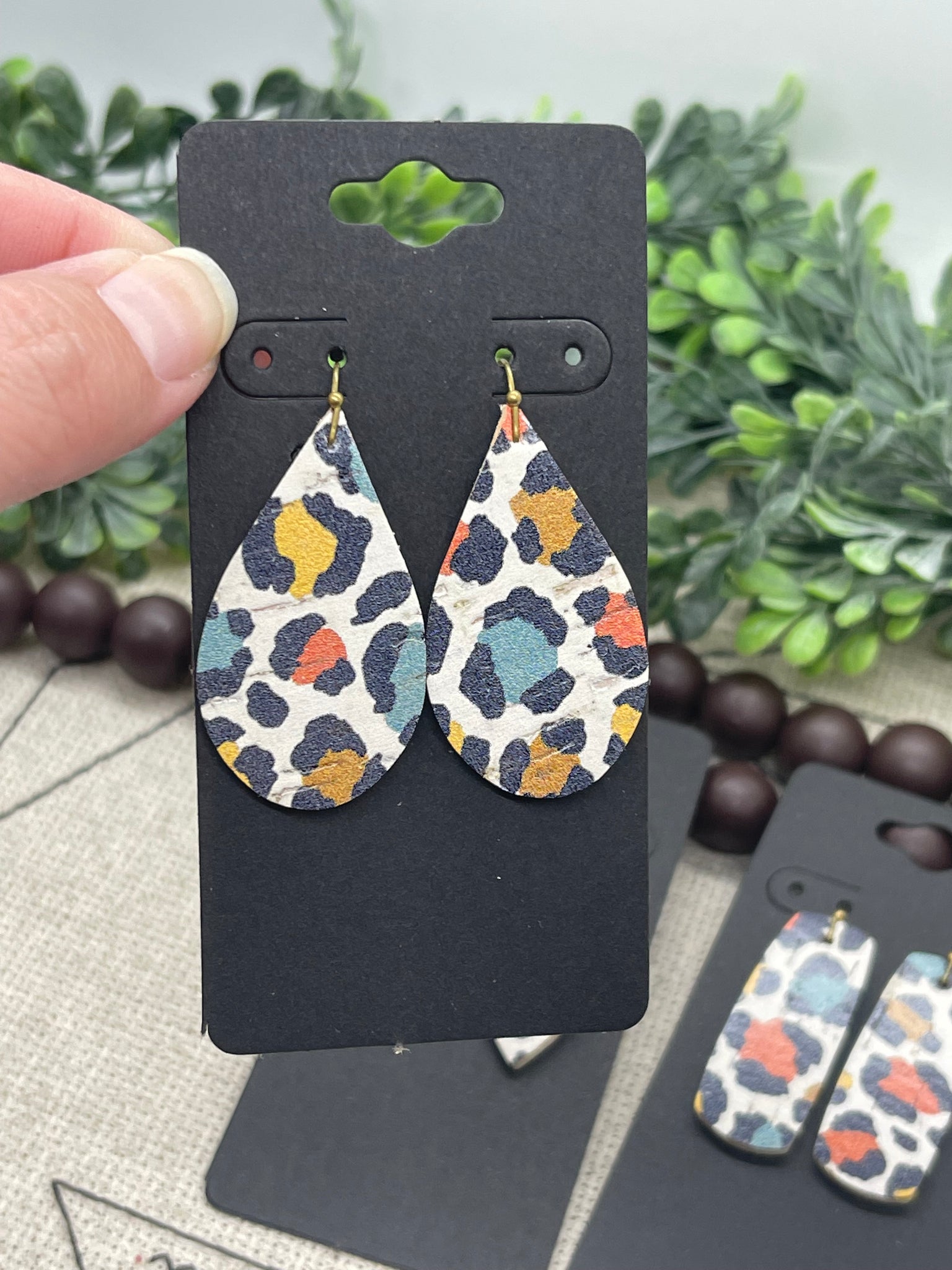 White Cork with Black Teal Mustard Yellow and Dark Orange Leopard Print on Leather Earrings