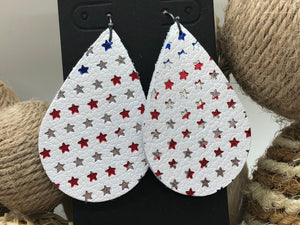 Red, silver, and blue stars on white leather