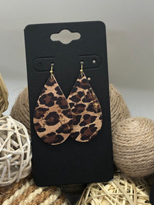 Black and brown leopard print on cork with hints of gold
