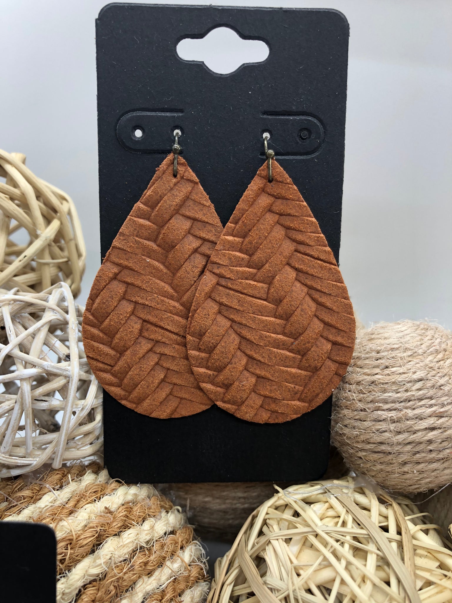 Cognac brown fishtail leather earrings