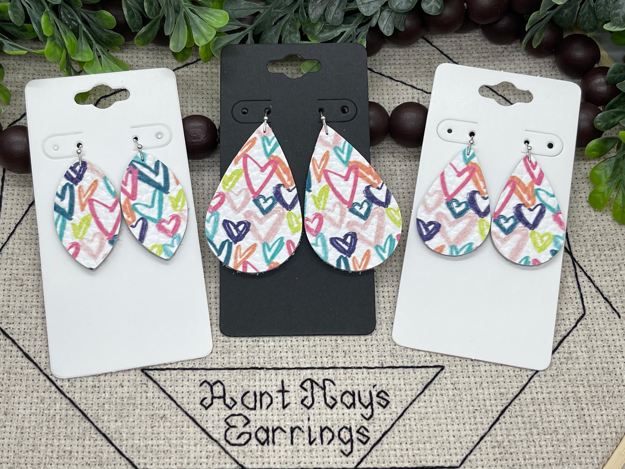 Pink Blue and Orange Heart Print on White Leather Earrings